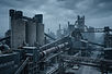 Clinker silos, kiln and conveyor galleries at a cement plant