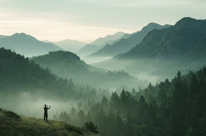 Misty green mountains at dawn