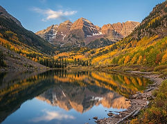 Maroon Bells in Colorado reflected in an alpine lake in autumn