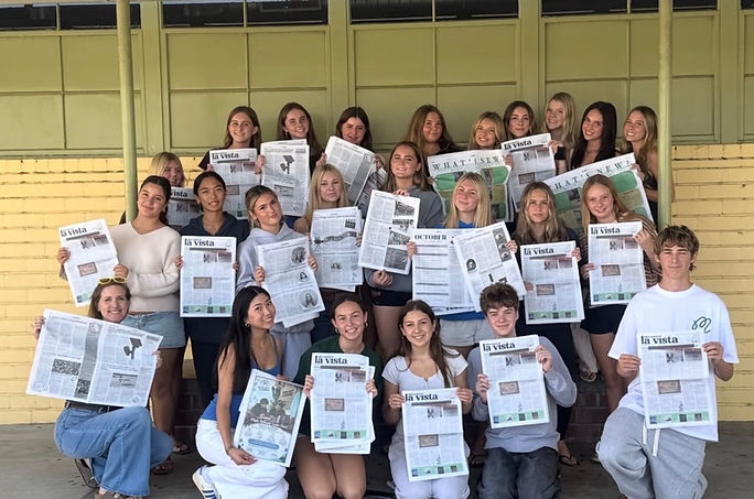 La Vista staff holding copies of the newspaper