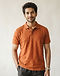 Slub Cotton Polo - Burnt Orange (Burnt Orange), worn or held by model