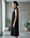 Minimalist Shift Dress (Black), worn or held by model