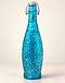 Turquoise textured glass swing-top bottle on stone