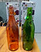 Orange and green Lifetile glass swing-top bottles with their boxes