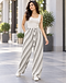 Grey and white diagonal band pleated trousers worn with a white tank top