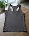 Athletic Racerback Tank (Charcoal), worn or held by model