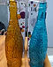 Amber and blue textured Lifetile glass swing-top bottles with their boxes
