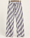 Sage stripe pleated trousers with drawstring on a wooden hanger