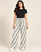 Grey and white diagonal band pleated trousers worn with a black tee