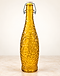 Amber textured glass swing-top bottle on stone