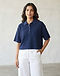Boxy Cropped Polo (Navy), worn or held by model