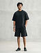 Heavyweight French Terry Sweat-Tee - Black (Black), worn or held by model