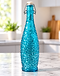 Turquoise textured glass swing-top bottle on a kitchen counter