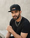 Urban Snapback Cap - Black (Black), worn or held by model