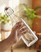 Eagle Rotlo Giara Glass Water Bottle - 1 Litre (Clear), lifestyle setting