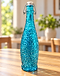 Turquoise textured glass swing-top bottle on a wooden table