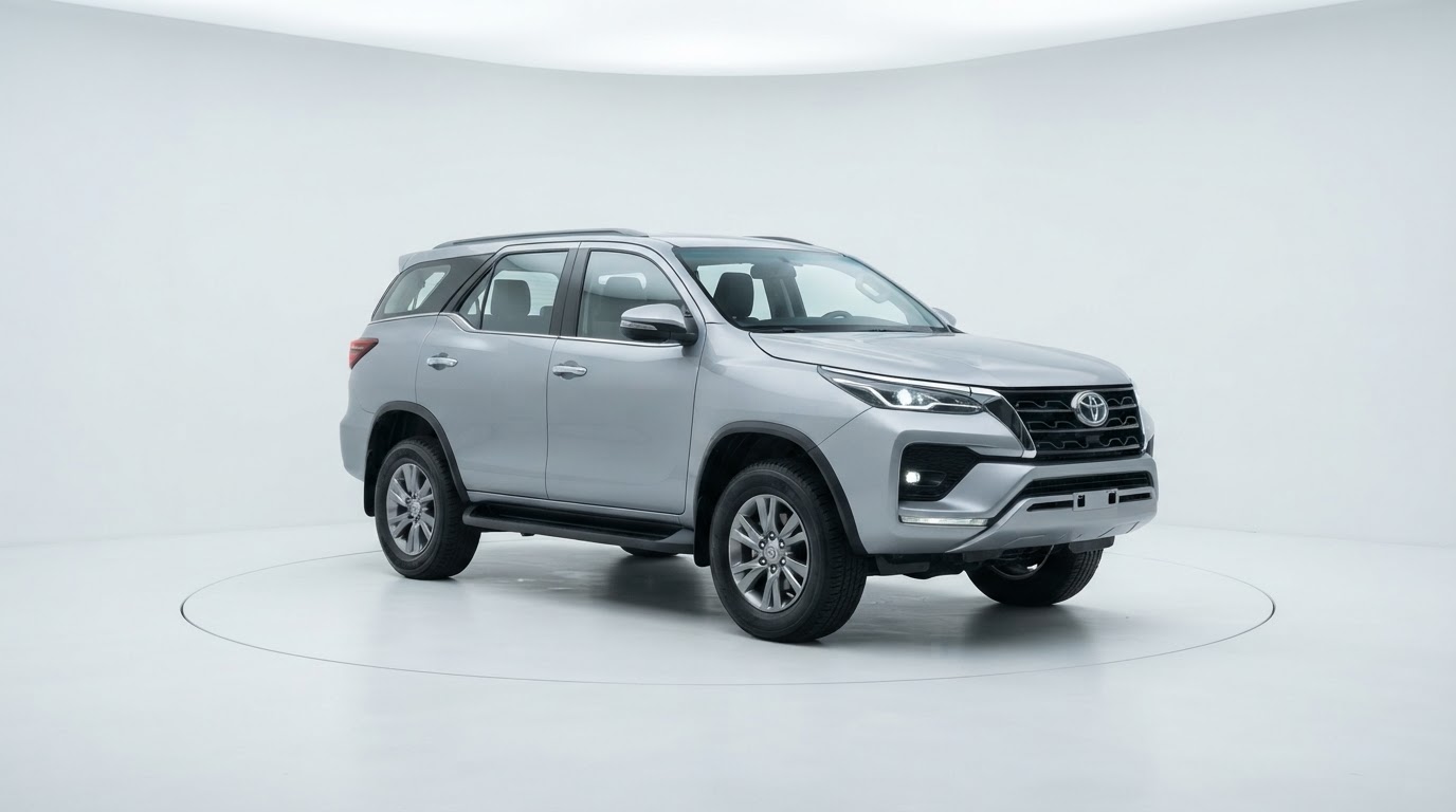 Silver Toyota Fortuner in a white studio