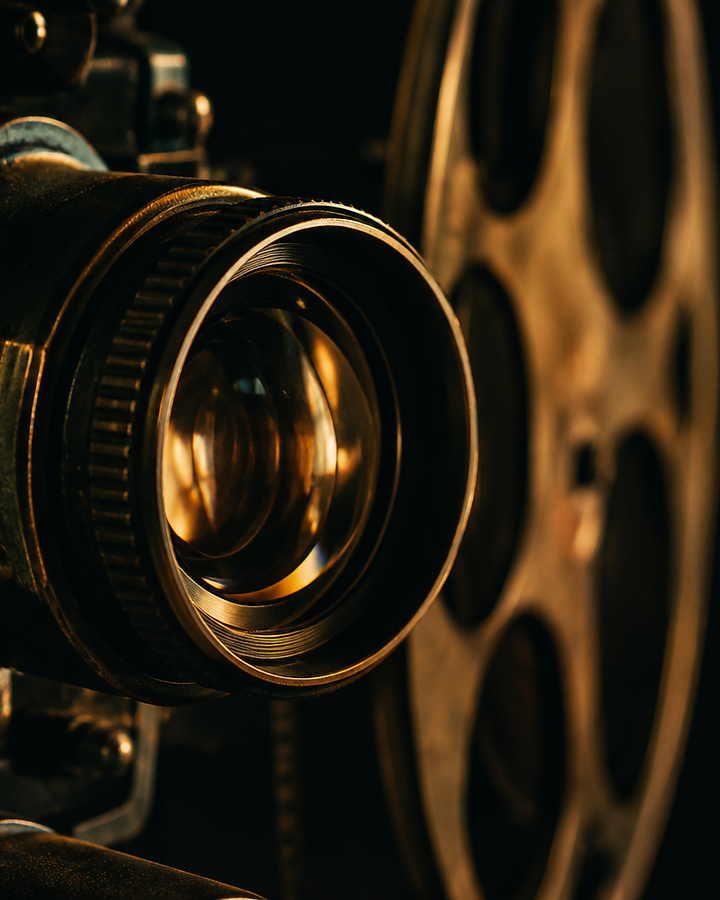 Close-up of a cinema camera lens in low light