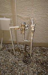 Corroded outdoor water line and valve assembly before replacement