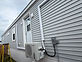 Exterior heat pump unit installed with line set and disconnect