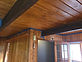 Refinished wood ceiling, beams and wall panelling