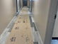 Hallway floor covered with protective board