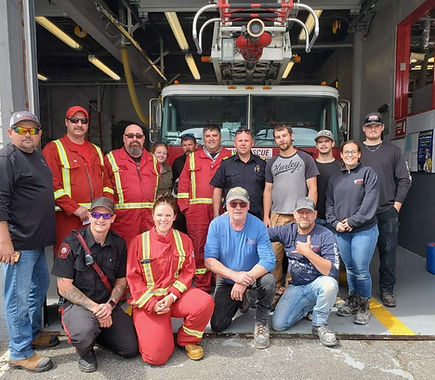 Northern Pipe & Plumbing team with Labrador City firefighters at the fire hall