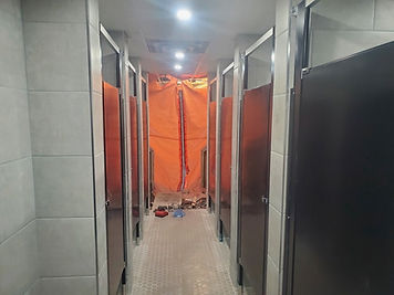 Commercial washroom renovation with new stalls