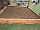 Timber-framed sandbox built for a playground