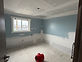 Room with water-damaged drywall replaced and drying