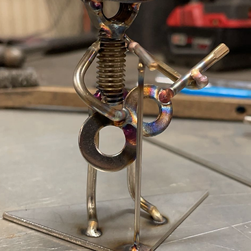 Handcrafted one-off metal art figure shaped and welded from steel