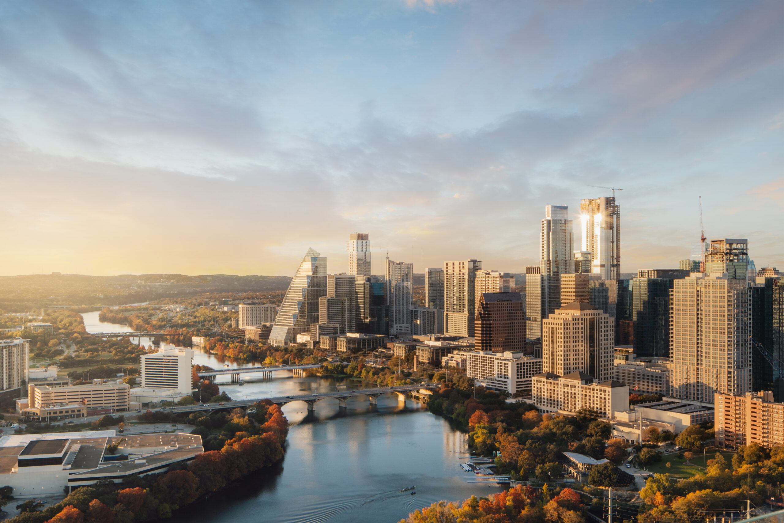 Austin, Texas skyline at golden hour with Lady Bird Lake