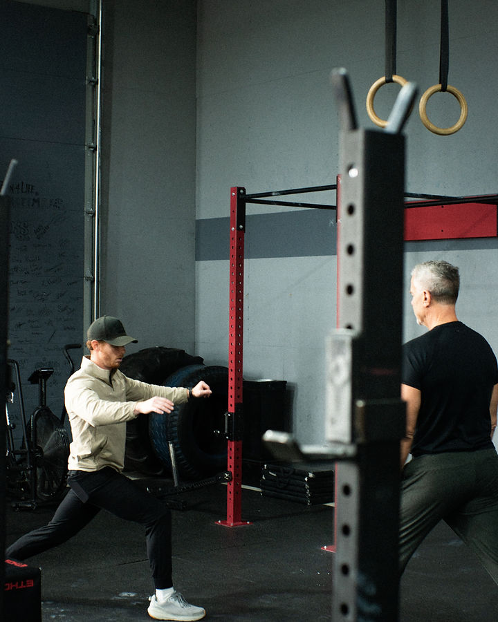 Athletes working through a session at the rack
