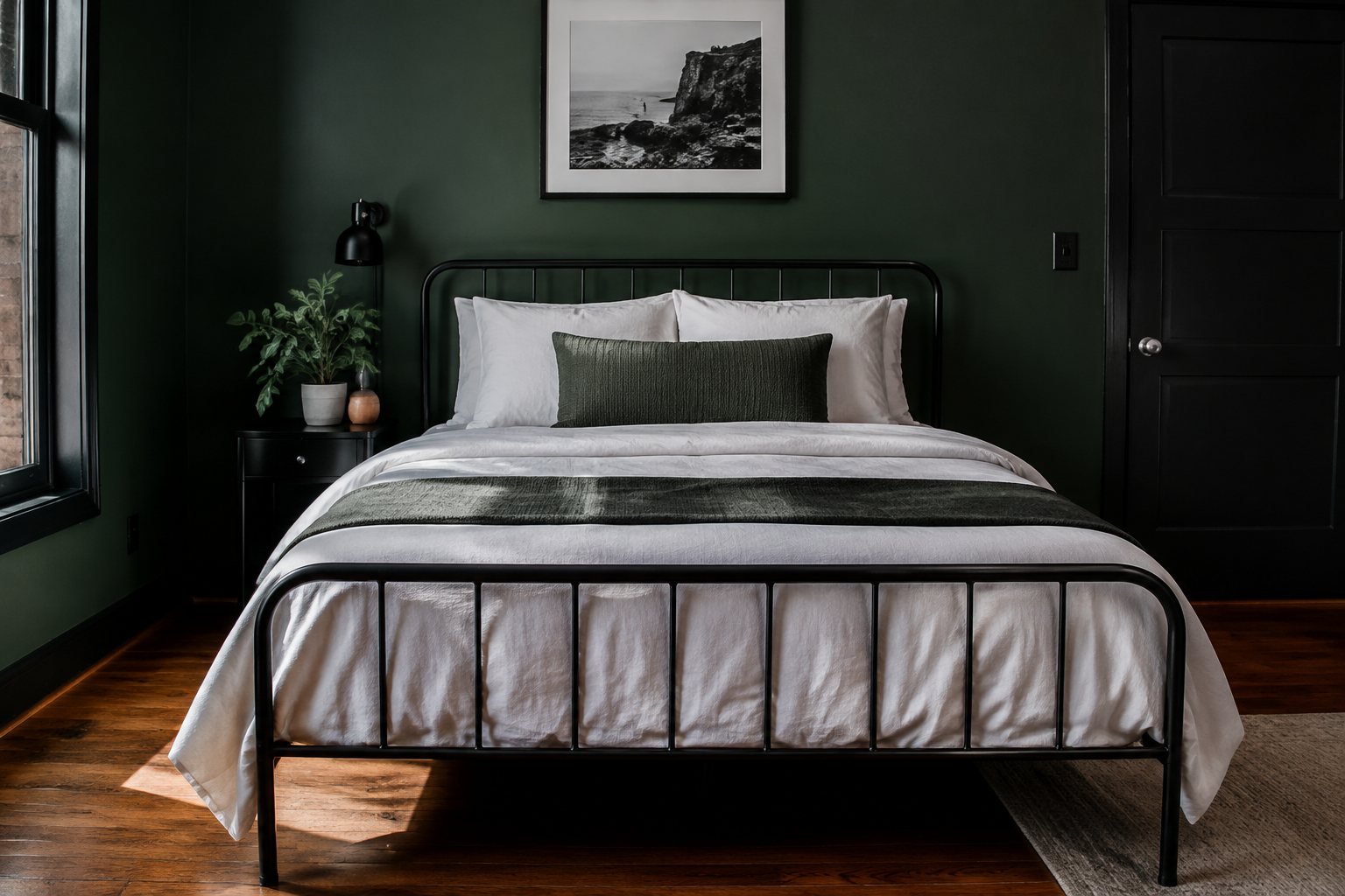 Black Metal Bed Frame Against Green