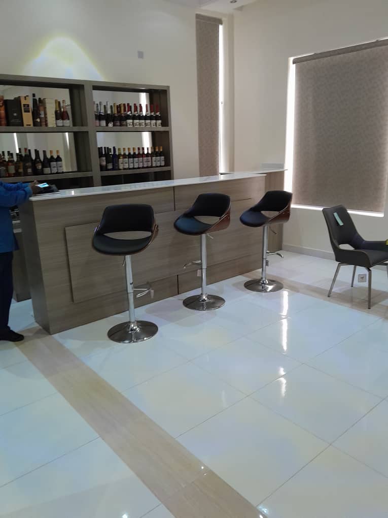 The lounge bar with a stone counter and mirrored shelving