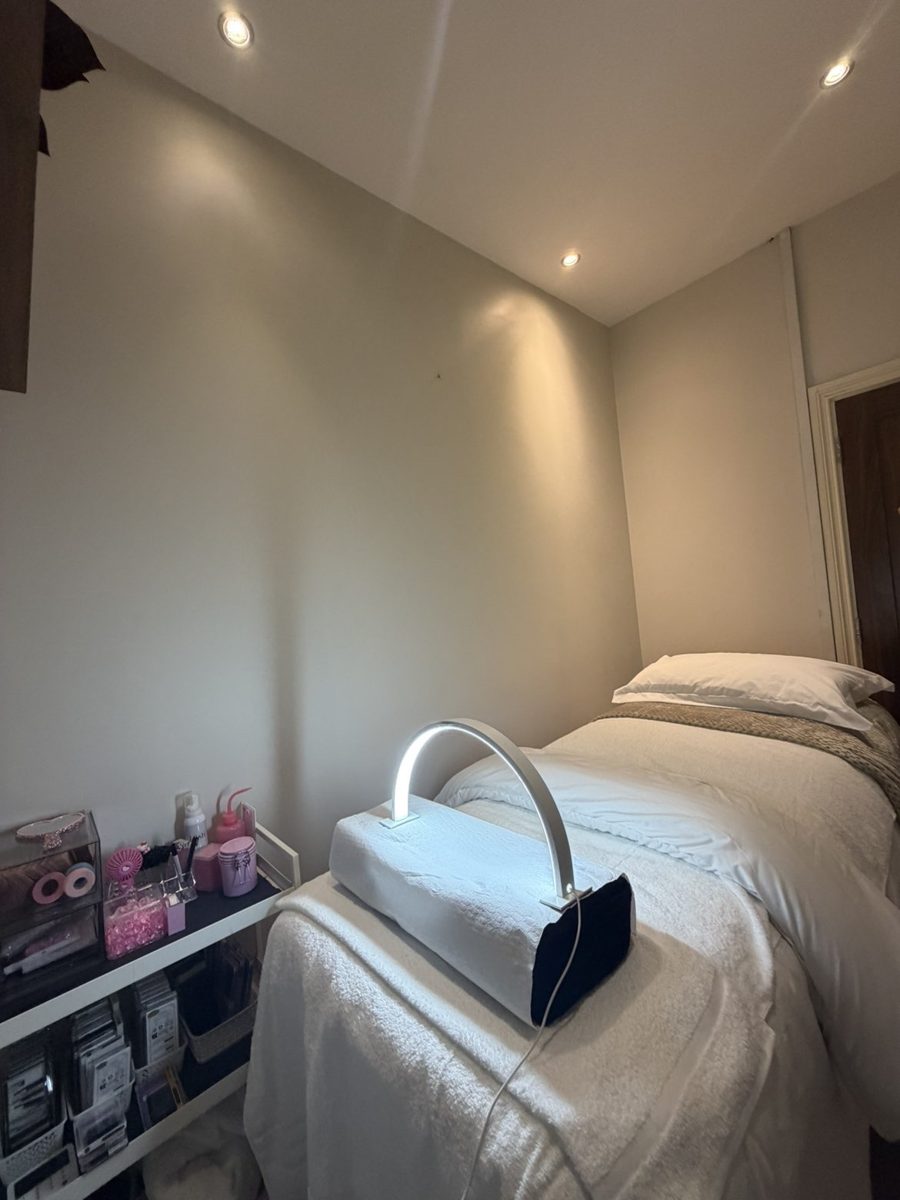 The AMP Lashes treatment room with a pink lash bed