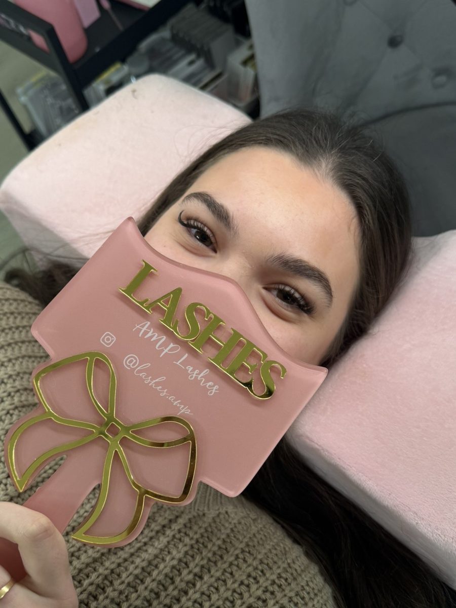 Client relaxing after a soft lash set at AMP Lashes