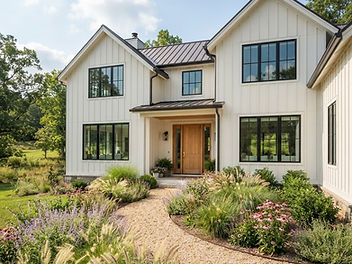 Warm white farmhouse with black grid windows and a natural wood front door