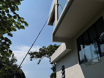 Reaching high glass on a modern seaside building