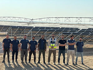 MH POWER team at an agricultural solar installation.
