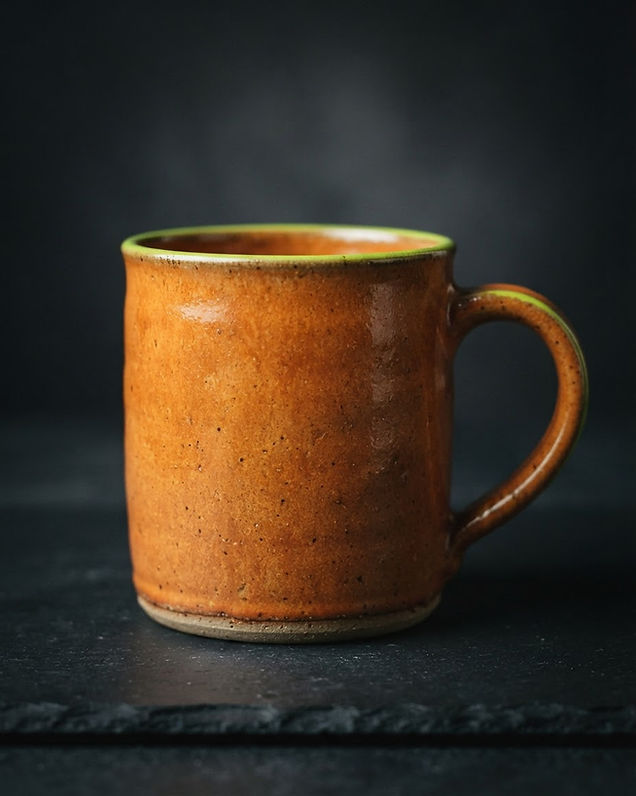 Stoneware mug on dark surface