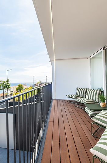 Terrace with lounge chairs overlooking the ocean horizon