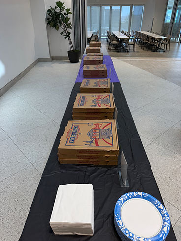 Pizza buffet station set up in an office lobby