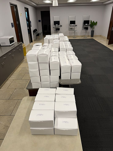 Boxed lunches stacked and ready for an office pickup