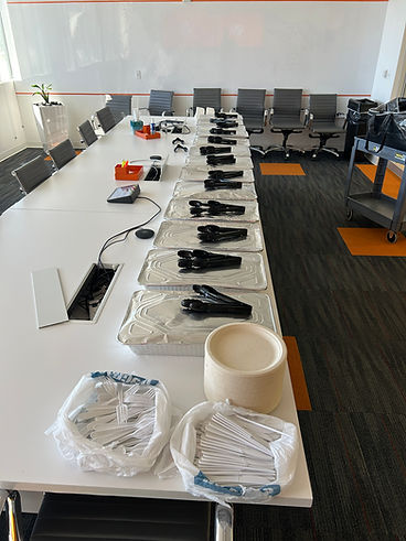 Chafing dishes lined up for a boxed lunch setup
