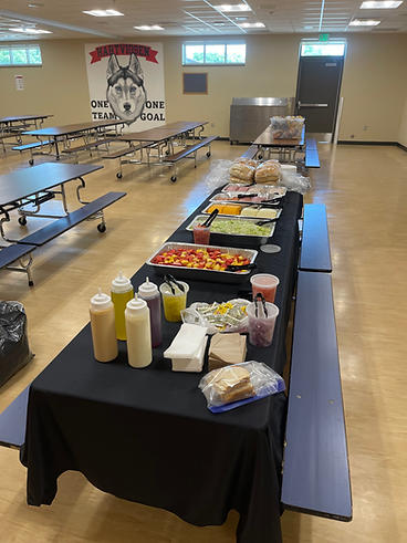 Sub sandwich catering table set up in a school cafeteria