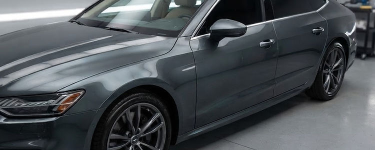 Car with dark ceramic window tint on the side and rear glass
