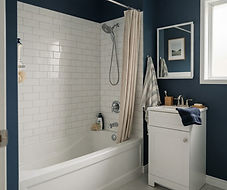 bathroom with a bathtub, shower fittings and a vanity faucet