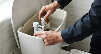 Plumbing work on a toilet cistern and its connections