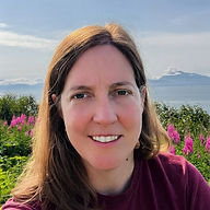 Dr. Susan Shaffer Sookram with fireweed in Alaska